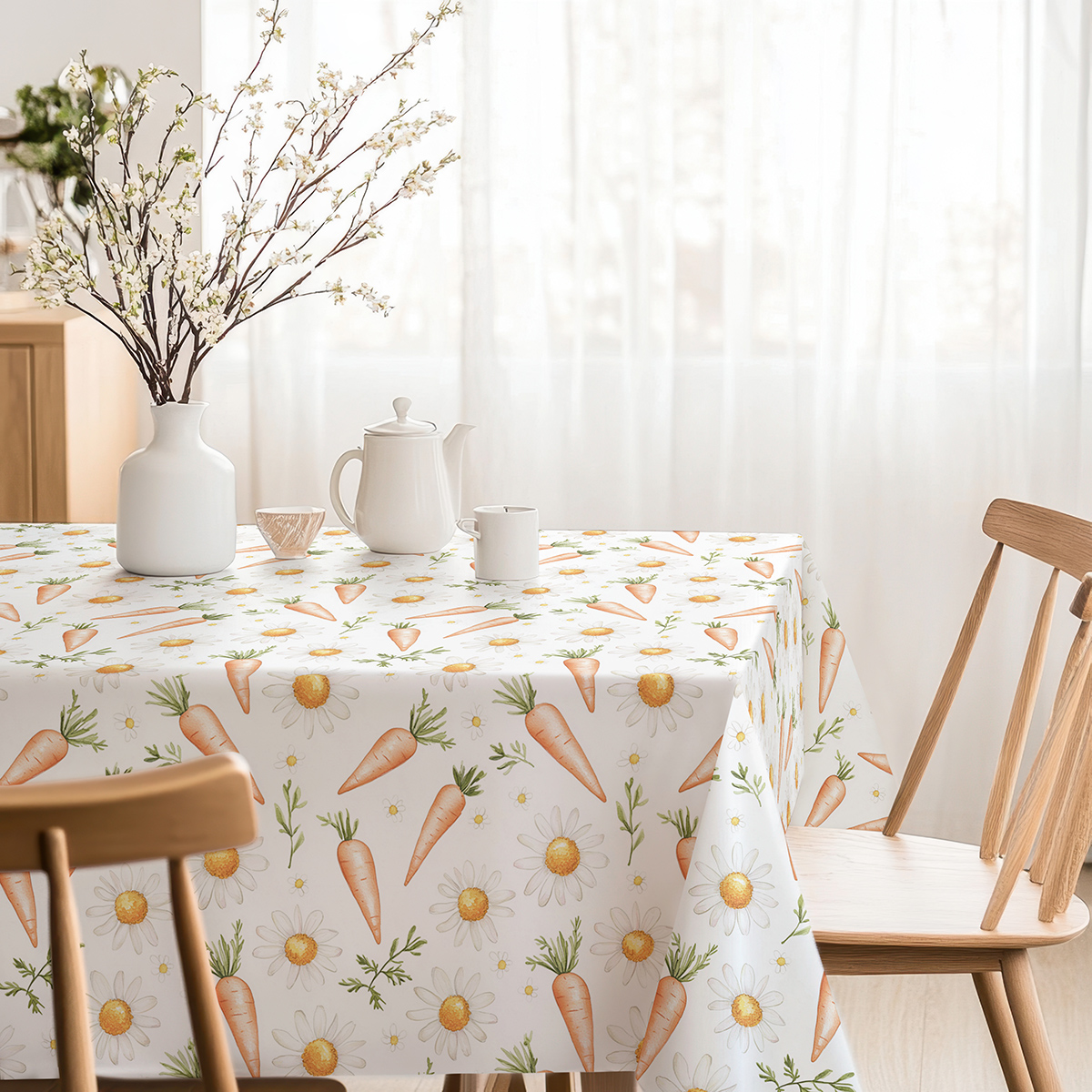Stół udekorowany obrusem z marchewkami i stokrotkami, inspiracja dekoracją świąteczną