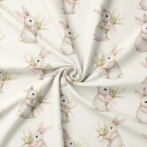 zbliżenie na wzór zajączka i kokardki na tkaninie