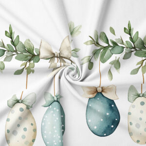 zbliżenie na akwarelowe pisanki, kokardki i fakturę tkaniny