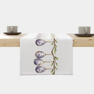 Bieżnik z motywem wiszących pisankami na gałązce rozłożony na stole, widok frontalny