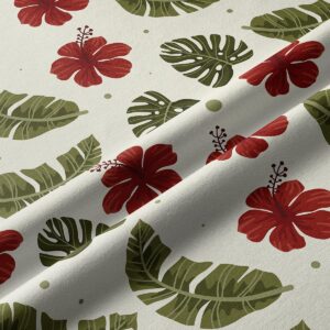 Zbliżenie na tkaninę pokazujące szczegóły liści i czerwonych kwiatów hibiskusa