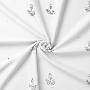 zbliżenie tkaniny pokazujące delikatny rysunek listków i rozmieszczenie małych kropek