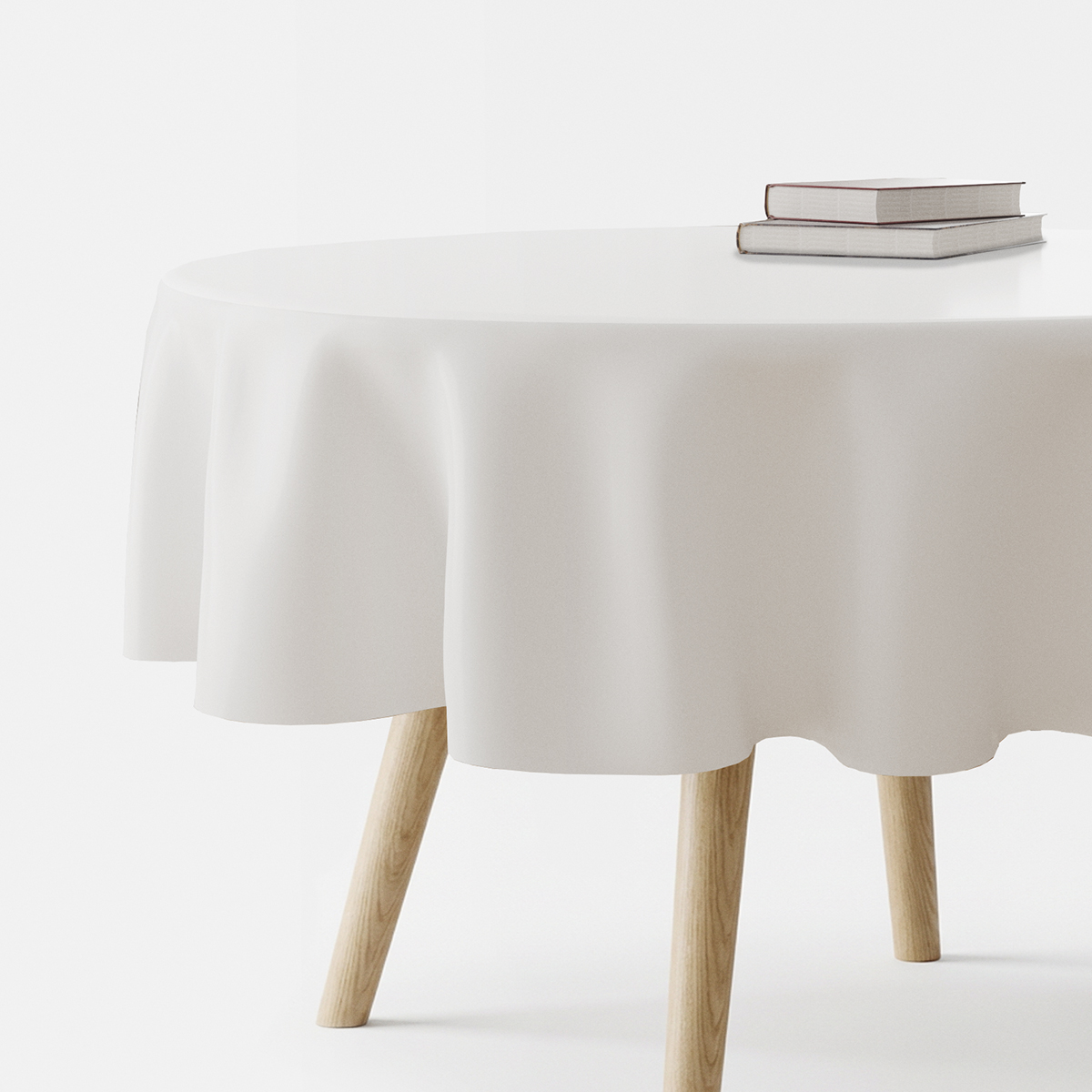 Okrągły biały obrus na stole z książkami, główne ujęcie produktu