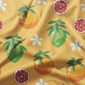 zbliżenie na tkaninę z detalem cytrusowych owoców i plasterków, widoczna struktura materiału