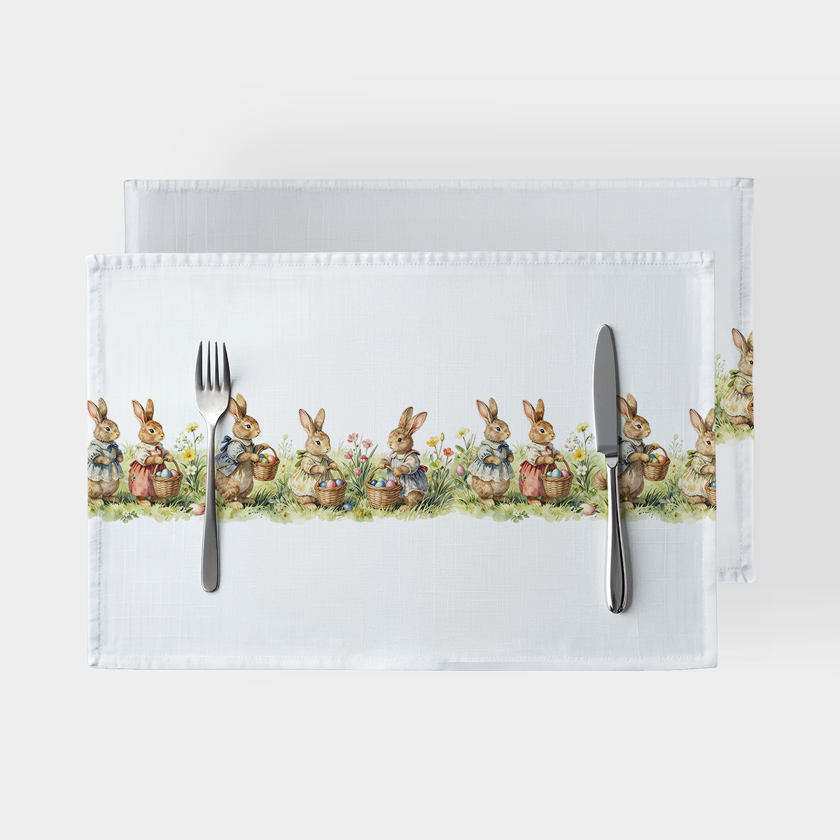 Podkładki stołowe z motywem króliczków niosących koszyczki z pisankami na białym tle