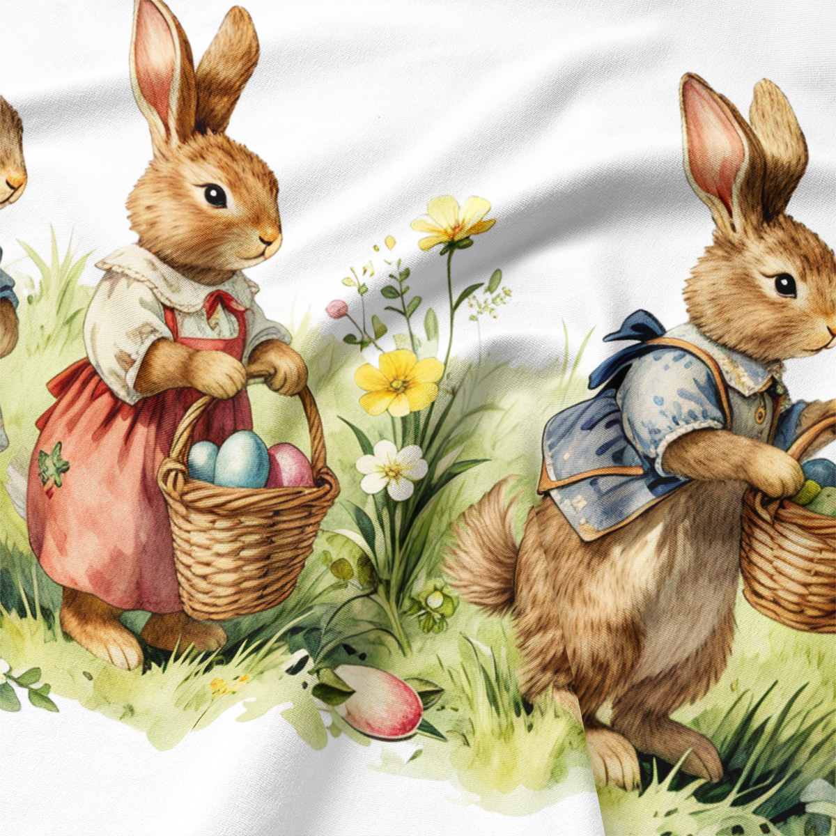 Zbliżenie na ilustrację króliczków i koszyczków z pisankami oraz fakturę tkaniny