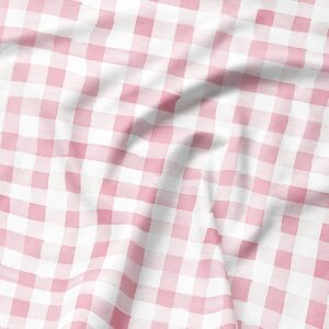 Zbliżenie na różową kratkę i fakturę tkaniny podkładki
