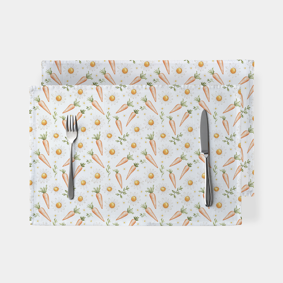 zestaw podkładek na białym tle z wzorem marchewek i stokrotek