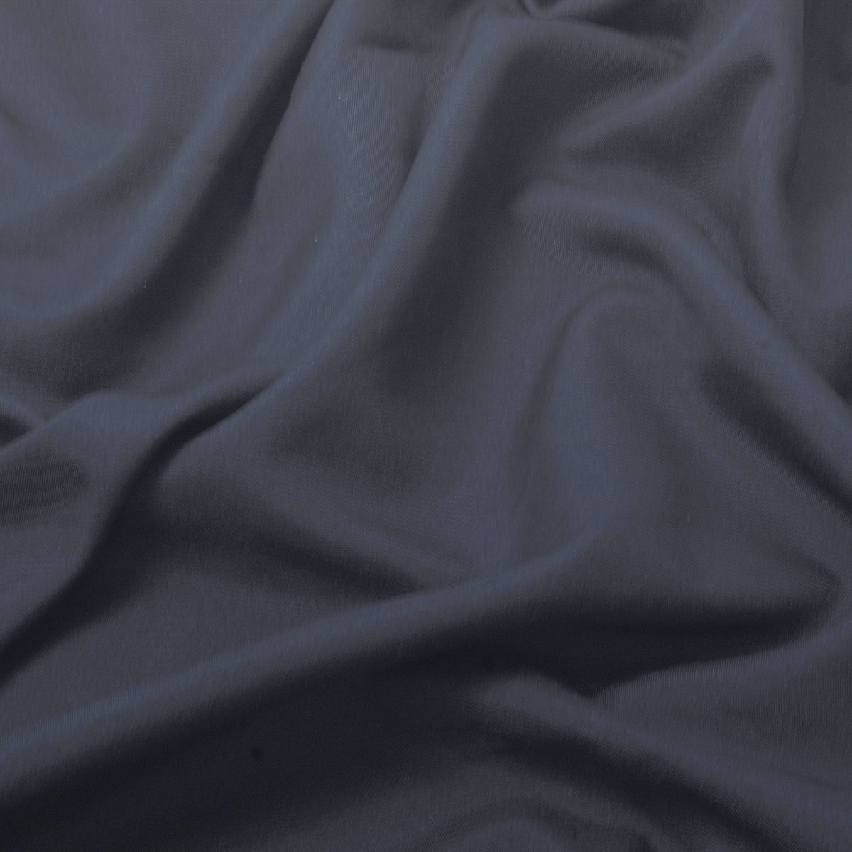 detal tkaniny obrusa pokazujący delikatną fakturę i miękkość materiału