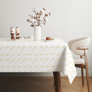 stół z dekoracją z suszonych bawełnianych gałązek i deserem na obrusie z motywem złotych gałązek
