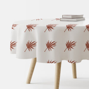 Okrągły obrus na stole z motywem palmowych liści, widok z boku