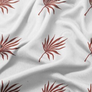 Zbliżenie na wzór palmowych liści na tkaninie i fakturę materiału