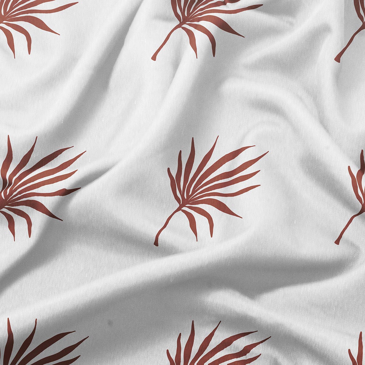 Zbliżenie na wzór palmowych liści na tkaninie i fakturę materiału