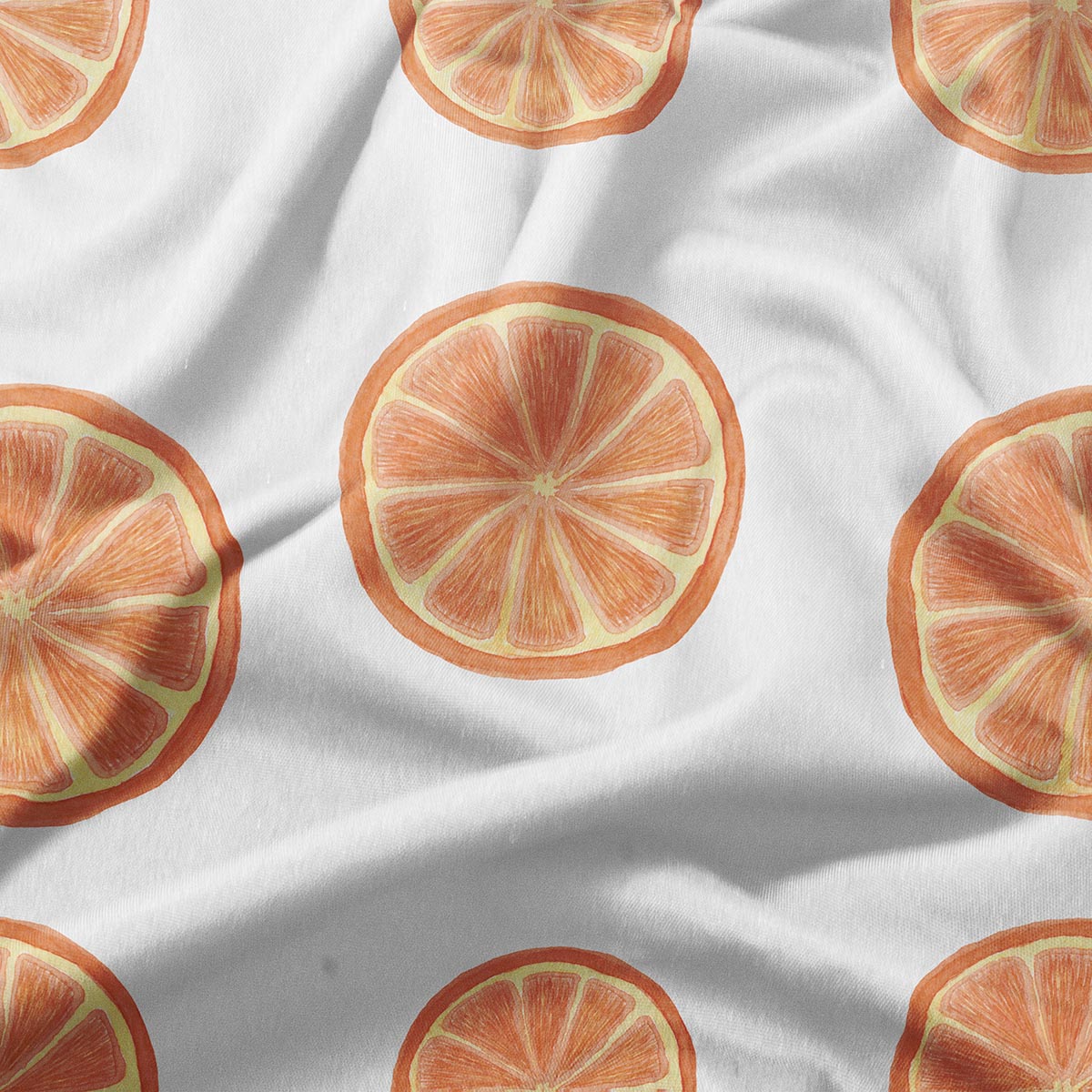 zbliżenie na wzór plasterków pomarańczy i fakturę tkaniny