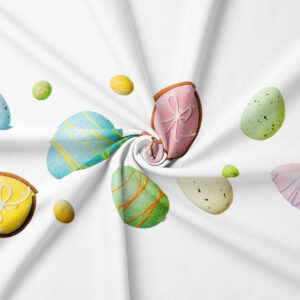 Zbliżenie nadruku pisanek i ciasteczek na tkaninie, detal koloru i faktury