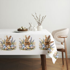 aranżacja stołu ze świątecznym obrusem, białe dekoracje i wiosenne dodatki na tle eleganckiego wnętrza