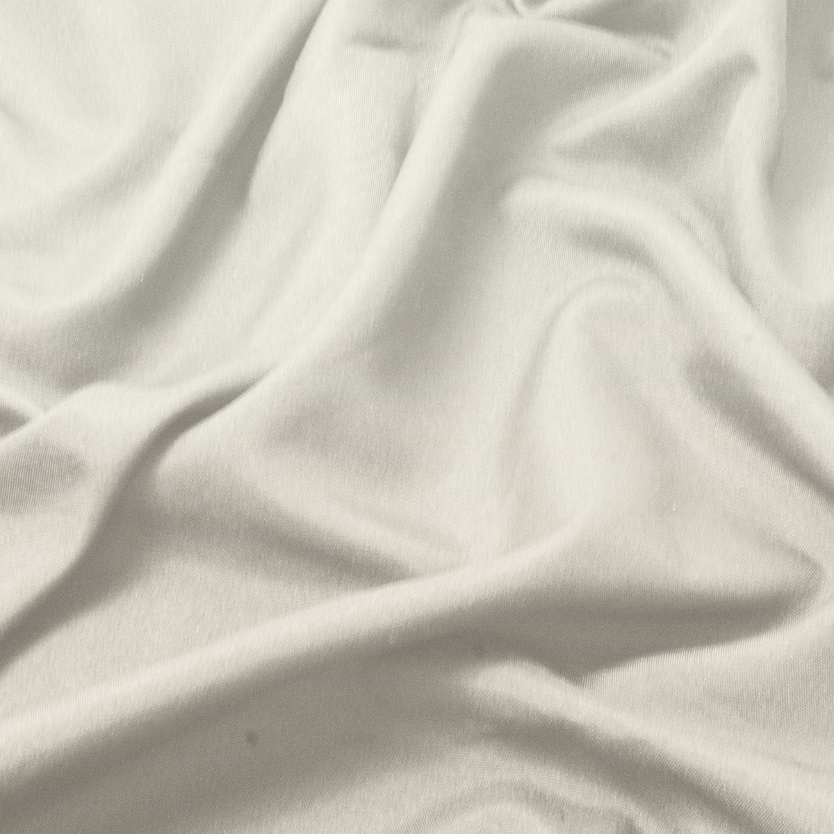 zbliżenie na fakturę kremowej tkaniny obrusa