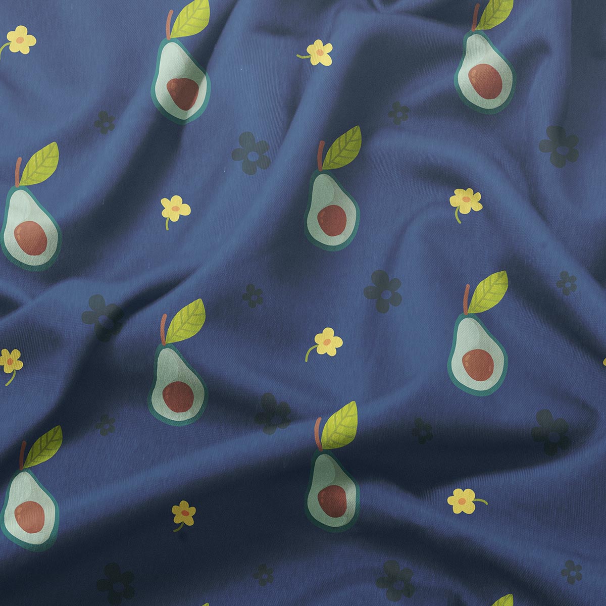 Zbliżenie na wzór z awokado i drobnymi kwiatkami na granatowej tkaninie