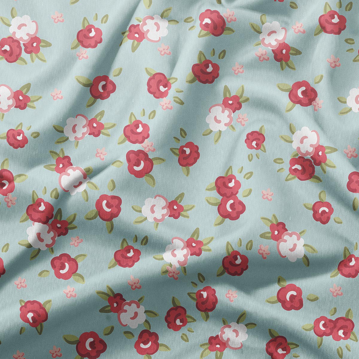 zbliżenie na tkaninę z wzorem małych różyczek i liści na miętowym tle