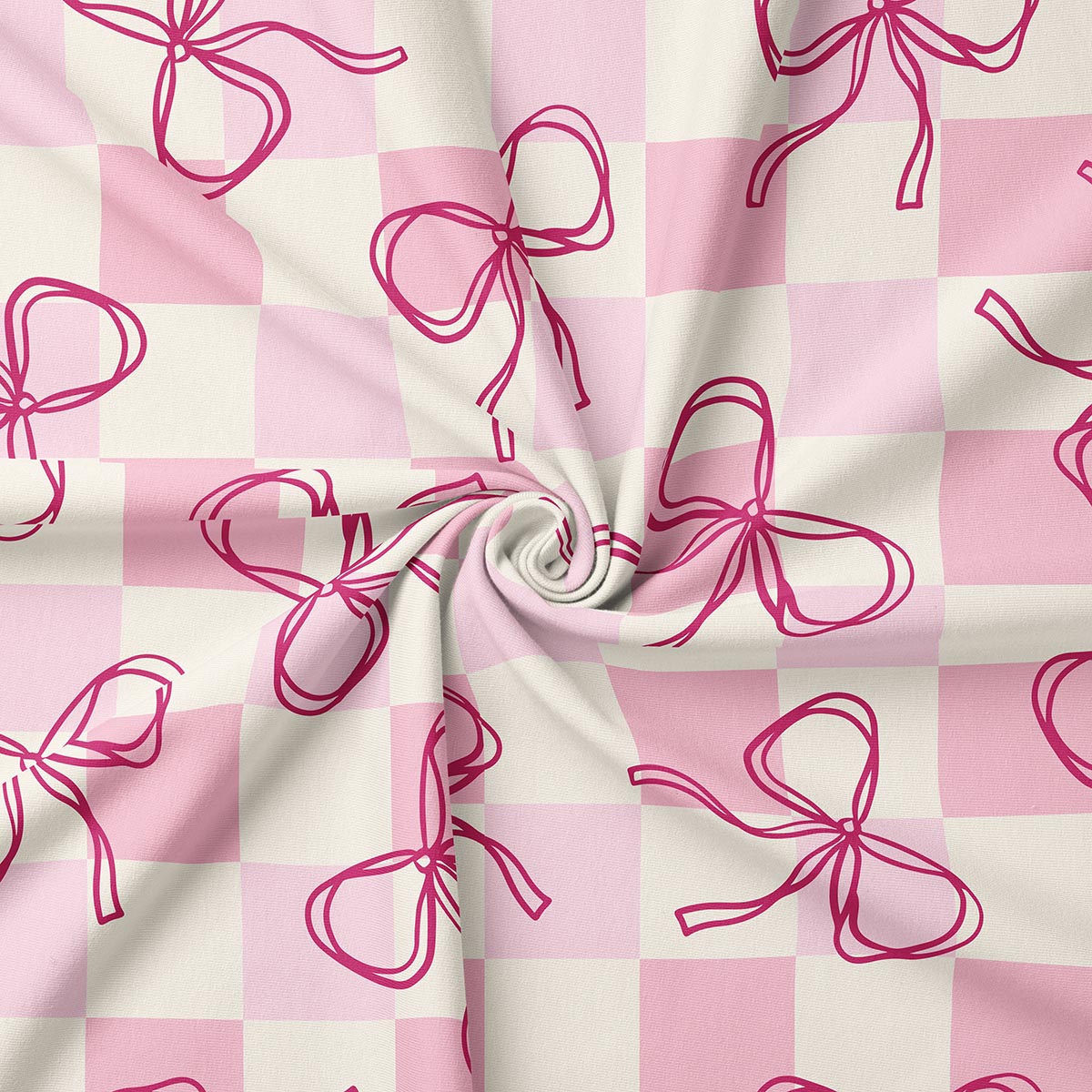 detal tkaniny pokazujący ręcznie rysowane kontury kokardek na kratkowanym tle