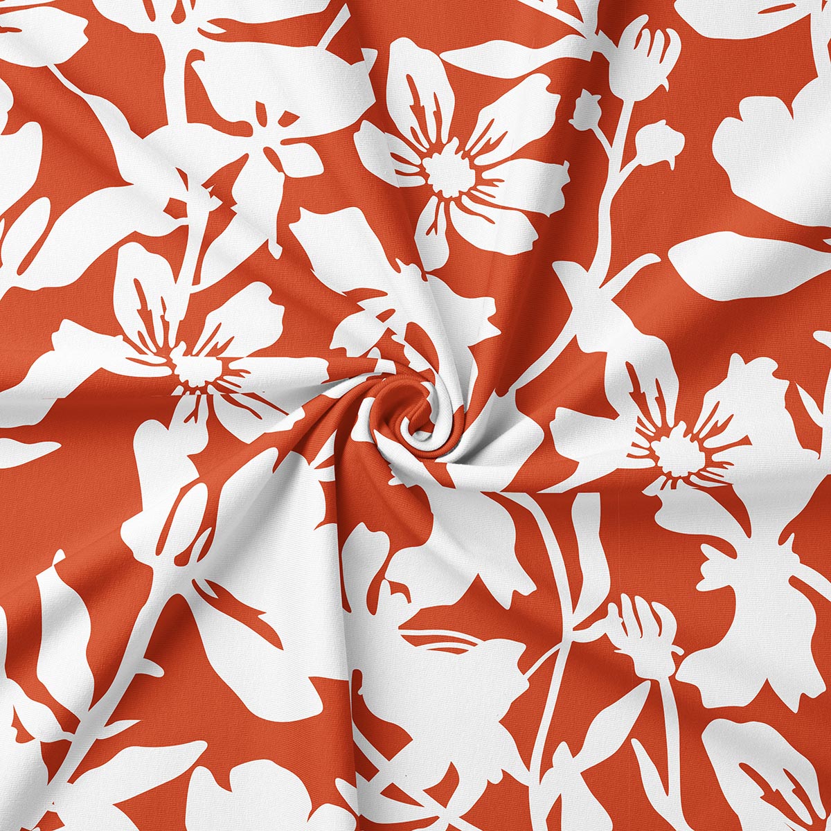 zbliżenie tkaniny pokazujące biały kwiatowy nadruk na ceglastym tle i fakturę materiału