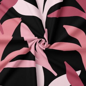 detal tkaniny obrusu pokazujący zbliżenie wzoru liści i strukturę materiału z zakręceniem