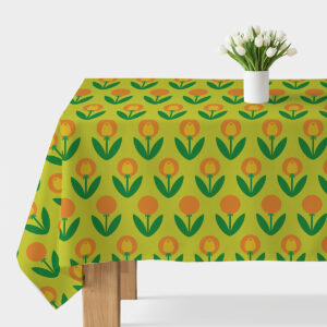 Obrus na stole z zielonym tłem i pomarańczowo-żółtymi stylizowanymi tulipanami, widok główny z białym wazonem