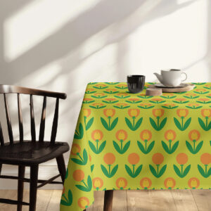 Ujęcie stołu z dekoracją i przekrojem wzoru, obrus w intensywnych zielonych i pomarańczowych tonacjach