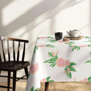 stół nakryty na śniadanie z obrusie i wazonem z bawełnianymi gałązkami