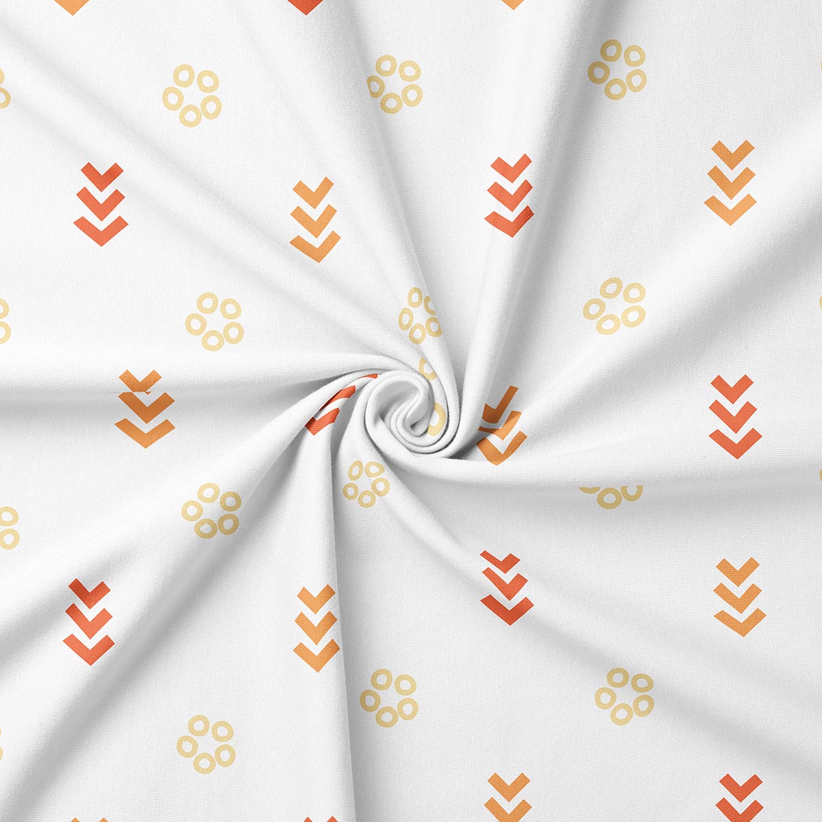 Zbliżenie na tkaninę pokazujące drobny wzór kółeczek i chevronów