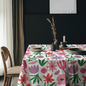 Aranżacja stołu z obrusem, ceramiczną zastawą i dekoracjami w przytulnym wnętrzu