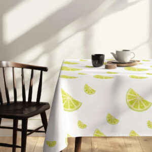 detal narożnika obrusa z limonkowym motywem przy drewnianym krześle