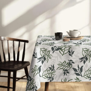 Detal krawędzi obrusu z powtarzającym się motywem roślinnym i subtelną szarą warstwą tła