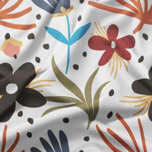 zbliżenie na detal nadruku z czerwonymi i niebieskimi kwiatami oraz drobnymi plamkami