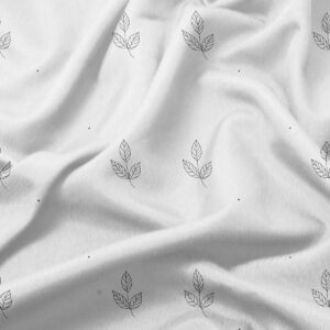 zbliżenie na materiał z nadrukowanymi listkami i małymi kropkami