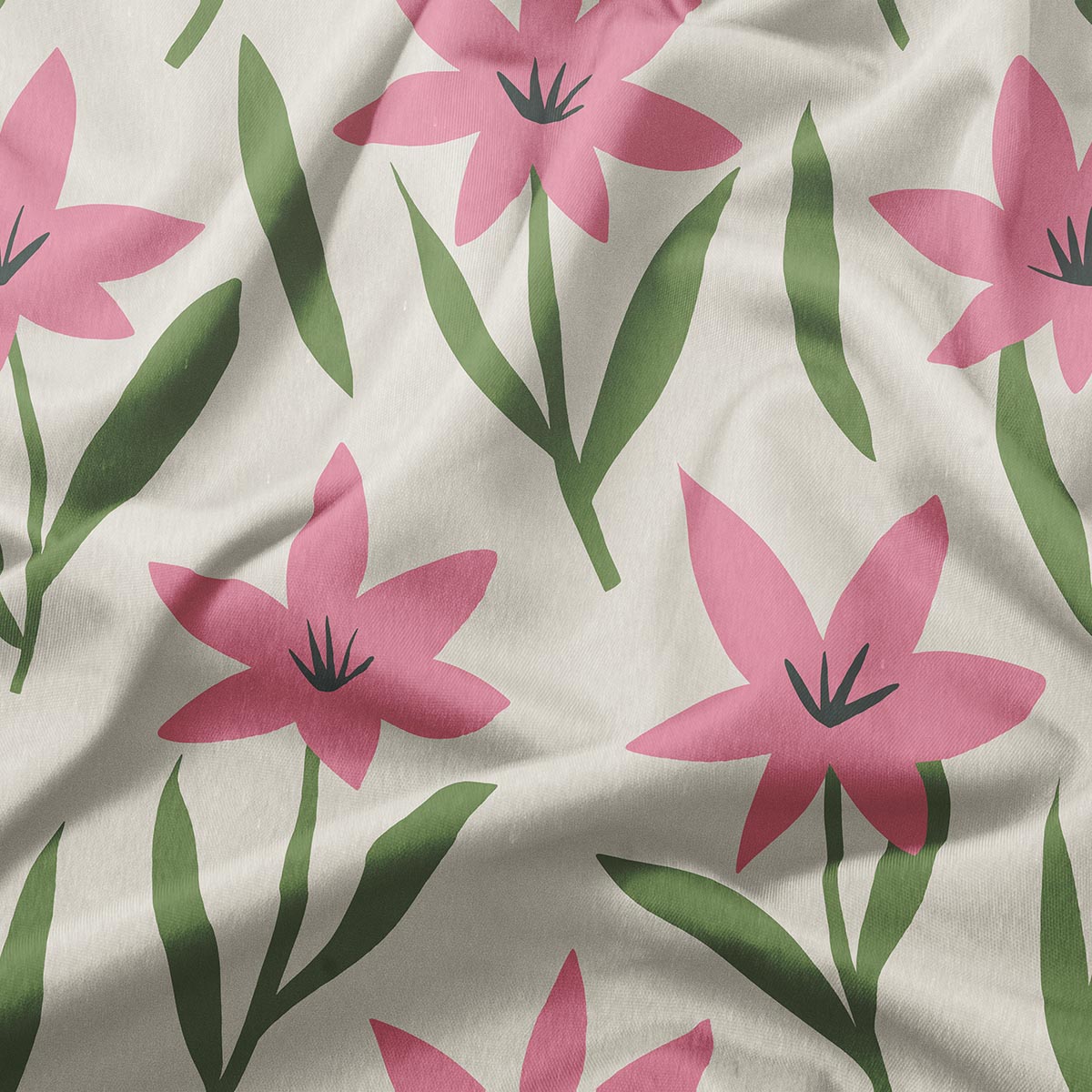 Zbliżenie na fakturę tkaniny i różowy kwiatowy motyw z zielonymi liśćmi