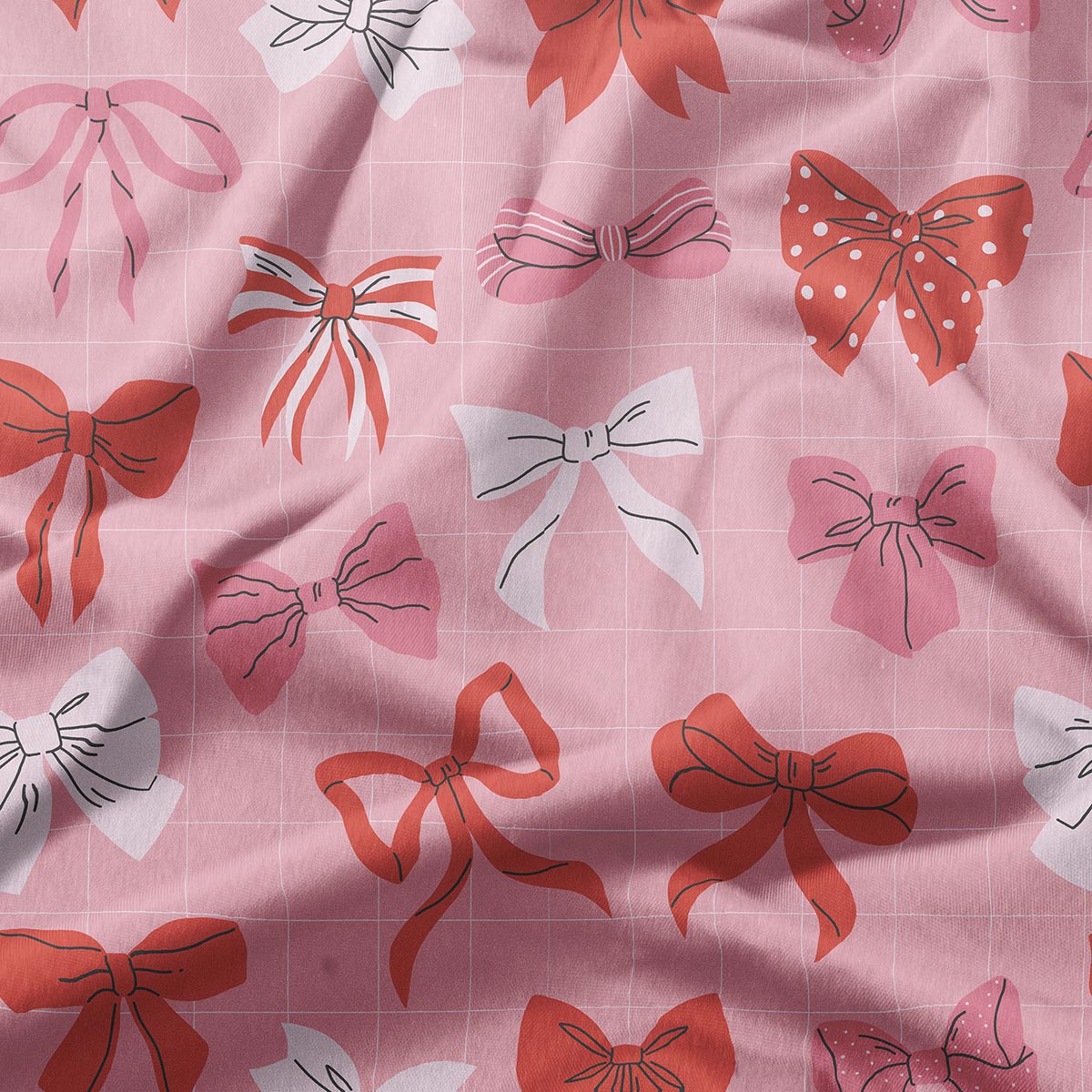 zbliżenie tkaniny pokazujące różnorodne kokardki i delikatną kratkę oraz fakturę materiału