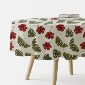 okrągły obrus na stole z czerwonymi hibiskusami i zielonymi liśćmi na kremowym tle