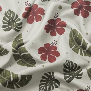 detal tkaniny z wzorem czerwonych kwiatów hibiskusa i tropikalnych liści