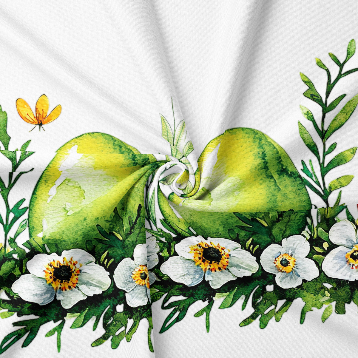 zbliżenie na akwarelowe zielone pisanki i białe kwiaty, widoczne sploty tkaniny