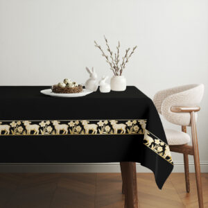 Aranżacja stołu z czarnym świątecznym obrusem i dekoracjami wielkanocnymi