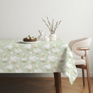 Aranżacja stołu z obrusm i dekoracjami wielkanocnymi, koszyk z pisankami