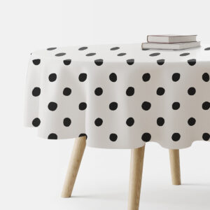 okrągły obrus na stole z czarnymi kropkami na białym tle, główne ujęcie produktu