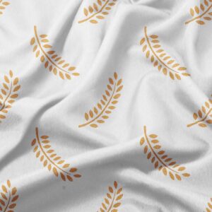 zbliżenie na tkaninę i szczegół złotego nadruku gałązek