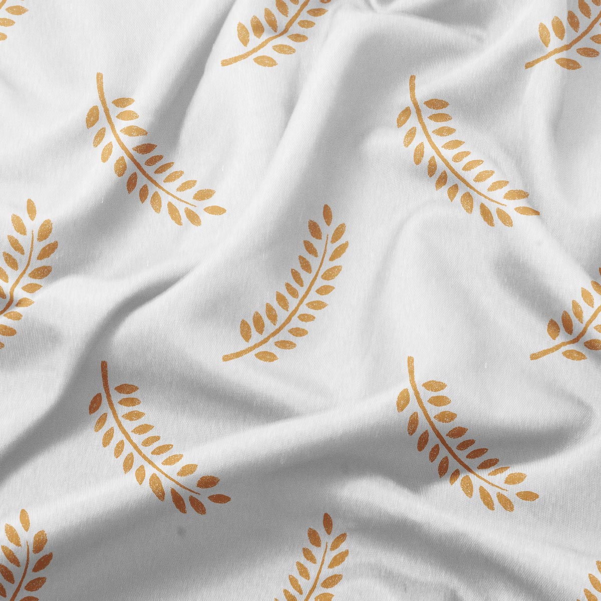zbliżenie na tkaninę i szczegół złotego nadruku gałązek