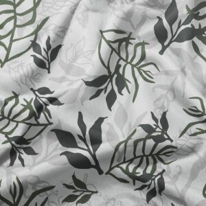 zbliżenie na tkaninę z liściastym nadrukiem pokazujące detale liści i delikatne cieniowanie
