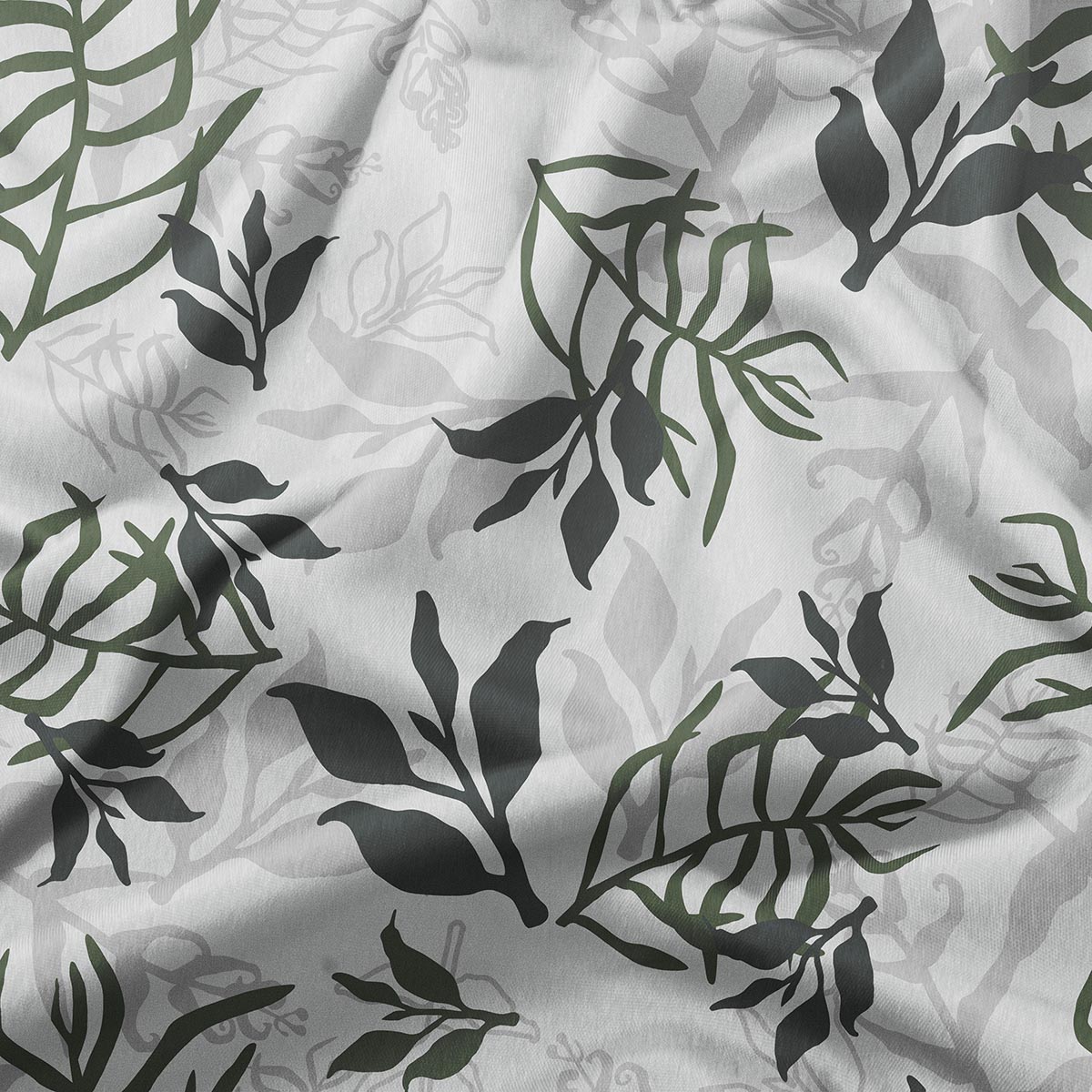 zbliżenie na tkaninę z liściastym nadrukiem pokazujące detale liści i delikatne cieniowanie