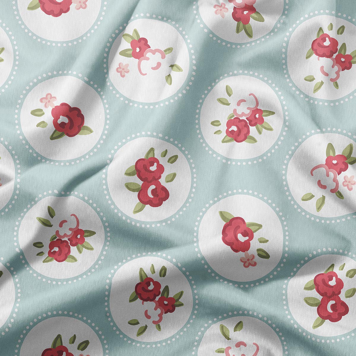 Zbliżenie na wzór: różowe kwiaty w okrągłych białych medalionach na miętowym tle