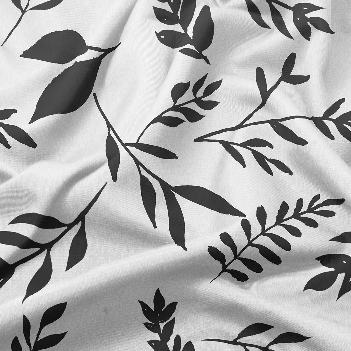 zbliżenie na tkaninę i kontrastowy nadruk liści