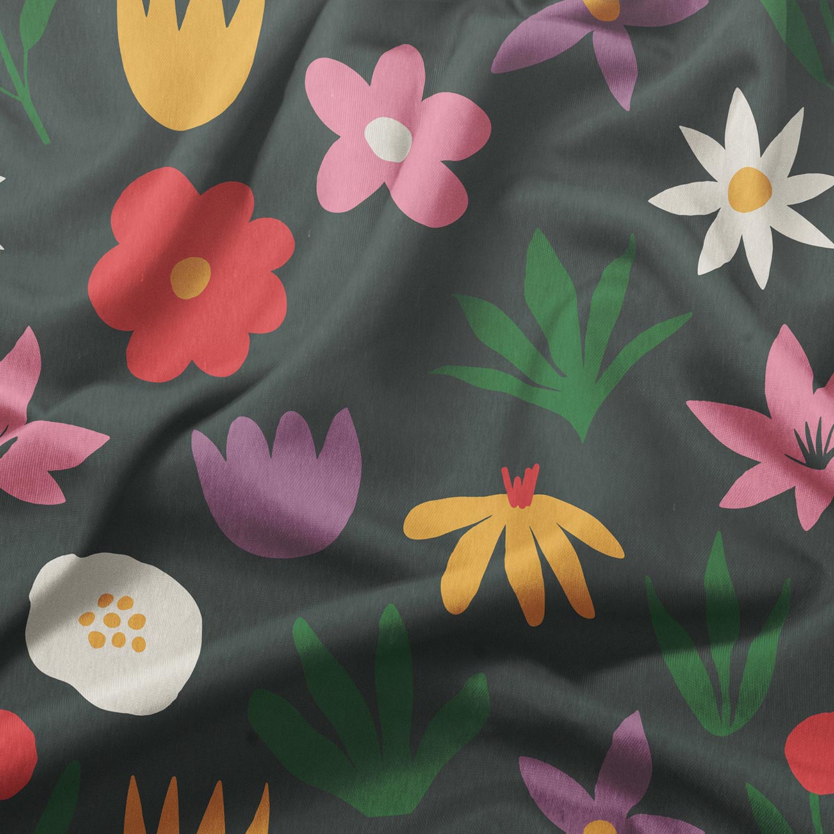 Zbliżenie na fakturę tkaniny i nadruk z czerwonym, różowym i żółtym kwiatem